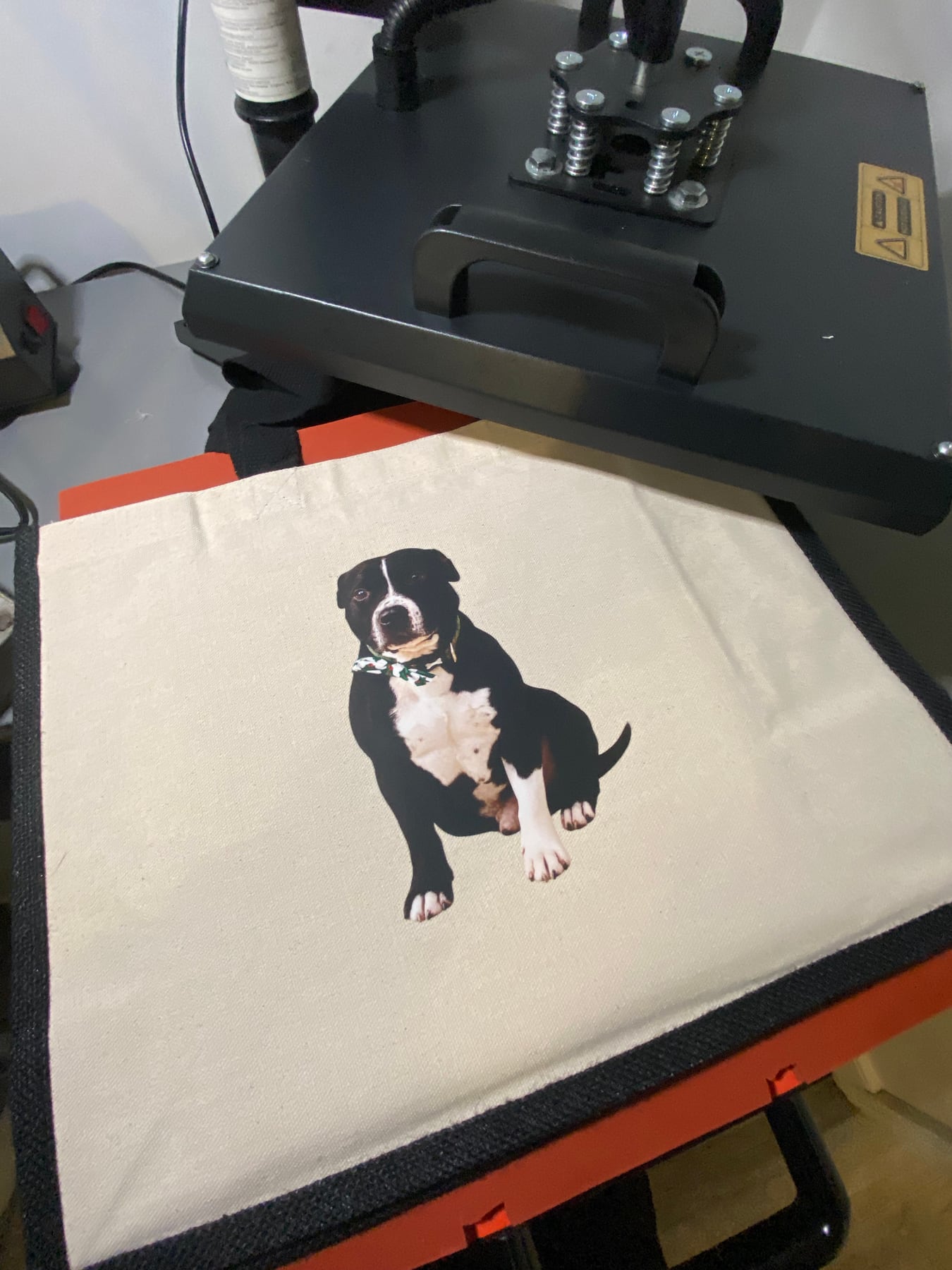 Black-trim personalised pet tote on Terry's heat press