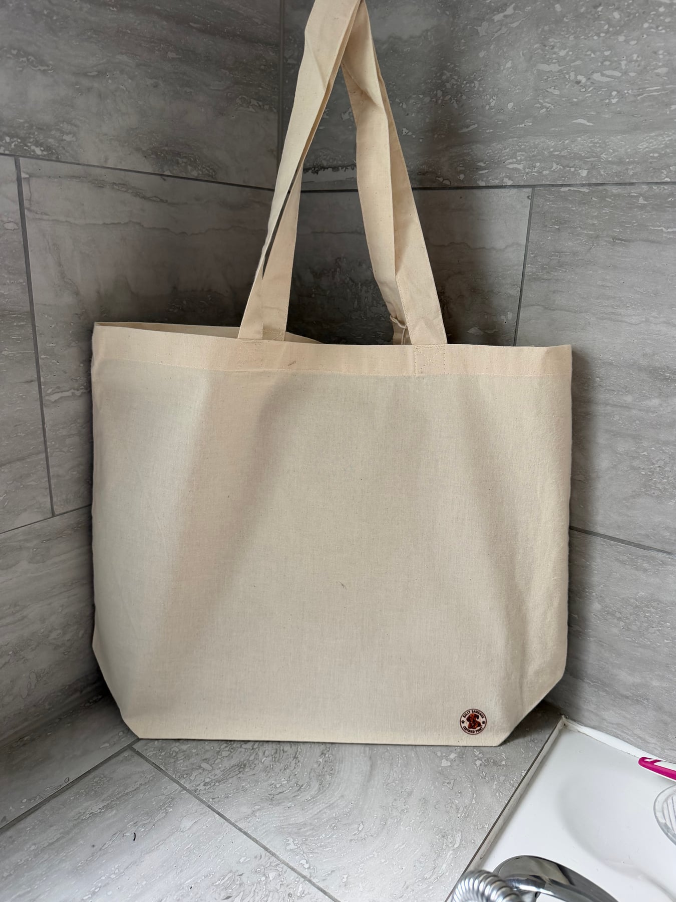 Reverse of Joey's natural tote with the Silly Sausage Certified Print badge