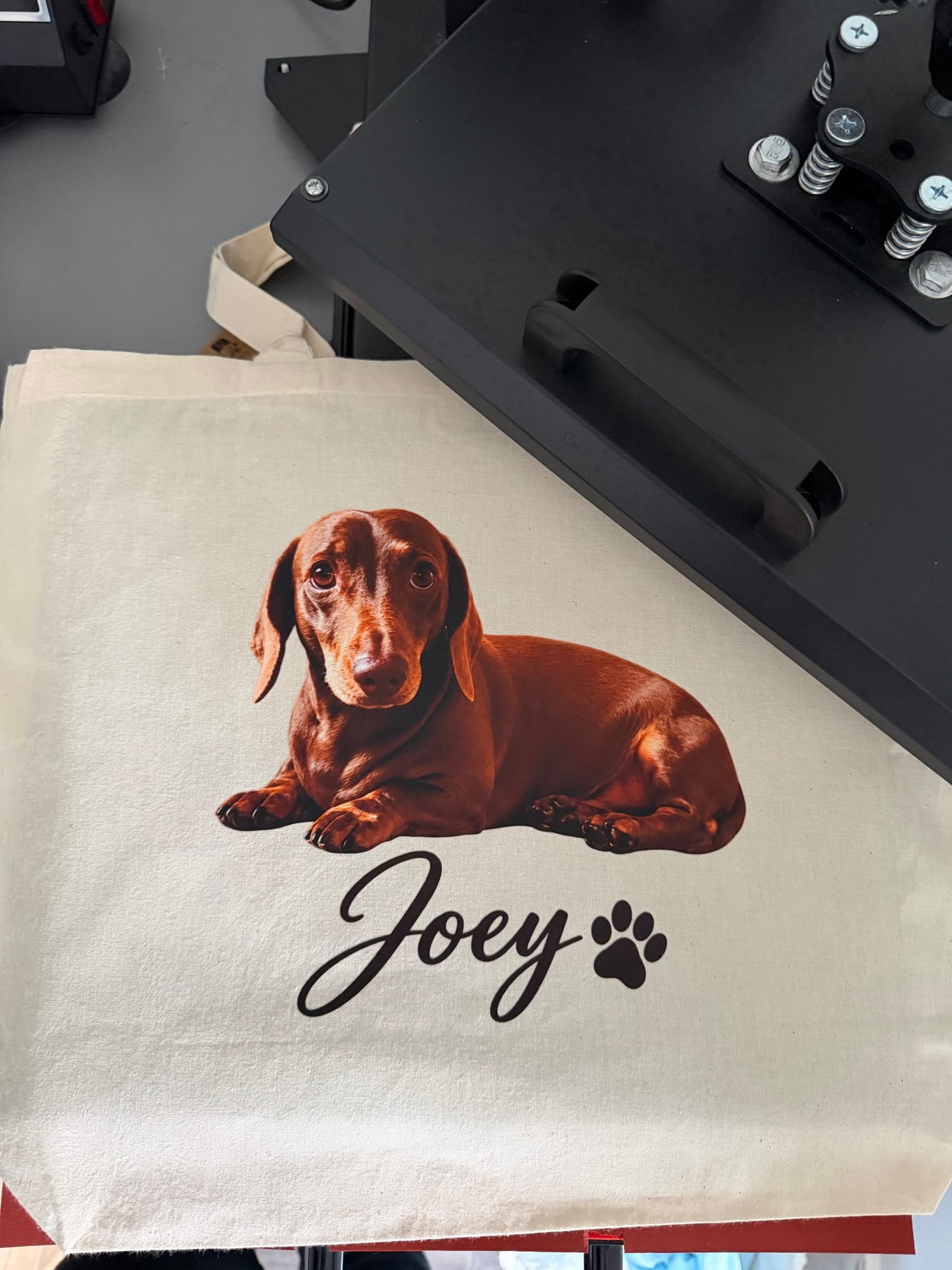 Joey personalised dachshund tote positioned on Terry's heat press